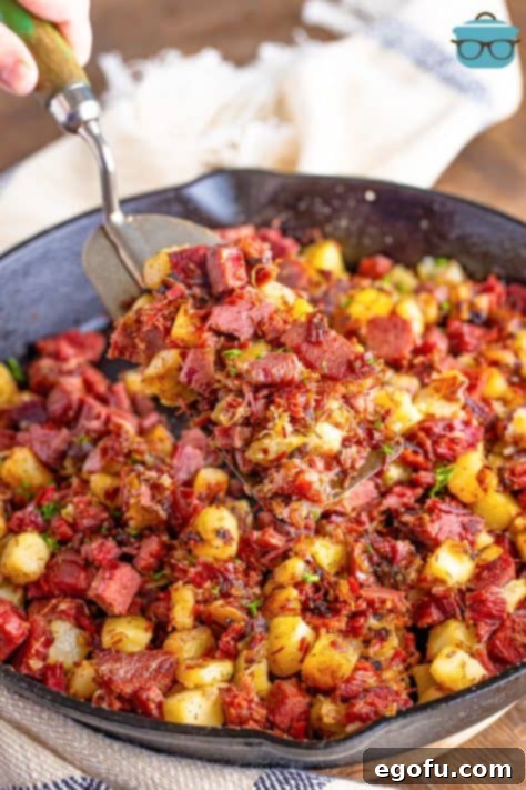 Homemade Corned Beef Hash 13 A serving utensil in a dish of Corned Beef Hash.