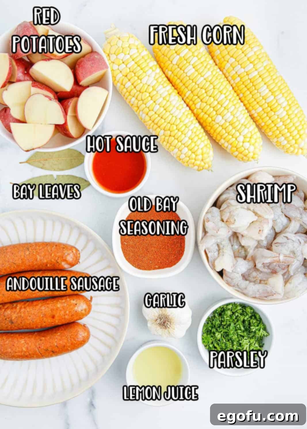 Red potatoes, corn on the cob, garlic, bay leaves, Old Bay, hot sauce, lemon juice, Andouille sausage, shrimp, and parsley.
