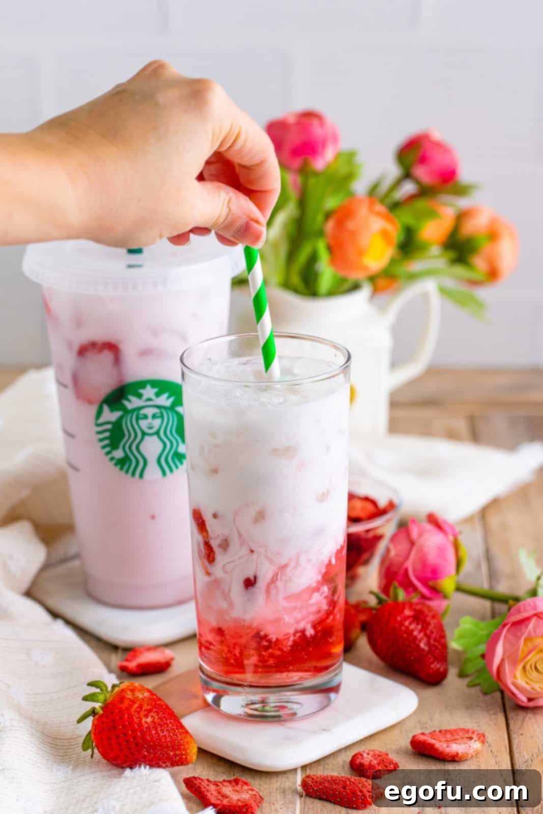 Starbucks' Iconic Pink Drink 7 A straw mixing the pink drink.