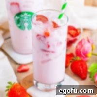 Starbucks' Iconic Pink Drink 9 A glass with a Starbucks Pink Drink.