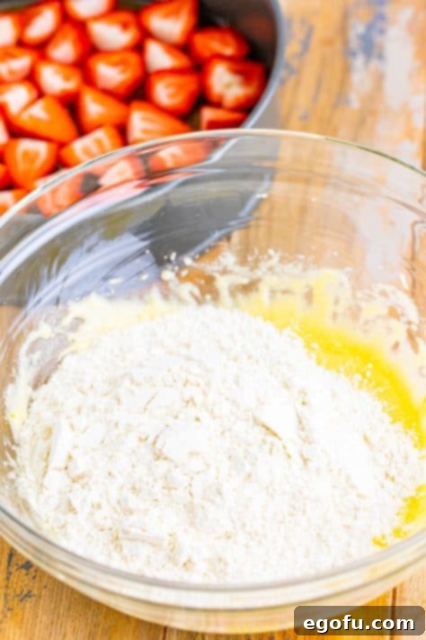 A mixing bowl with the flour mixture and butter mixture.