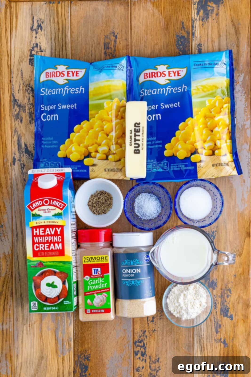 Frozen corn, heavy cream, whole milk, salted butter, garlic powder, onion powder, kosher salt, cracked black pepper, granulated sugar, and all purpose flour.