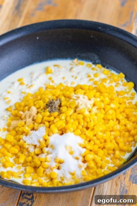 corn, salt, pepper and heavy cream in a skillet.
