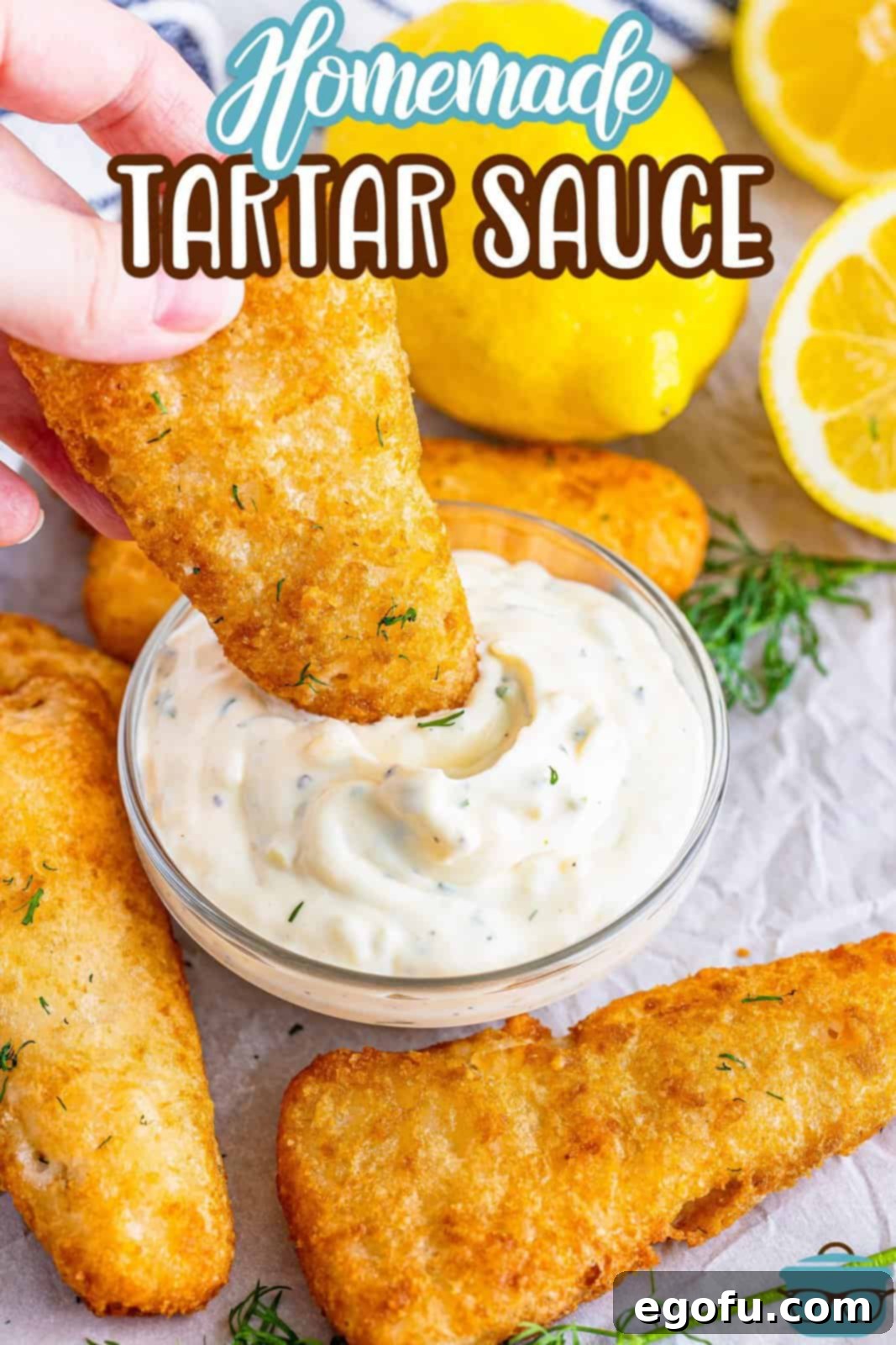 Tangy Homemade Tartar Sauce 4 A crispy fish filet being dipped into a container of creamy homemade tartar sauce.