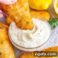 Tangy Homemade Tartar Sauce 8 A small bowl filled with creamy homemade tartar sauce.