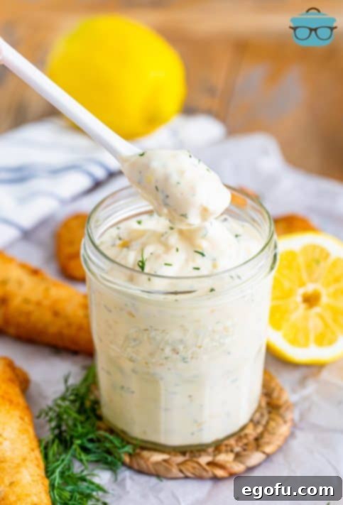 Tangy Homemade Tartar Sauce 10 A spoon holding some fresh made homemade tartar sauce.