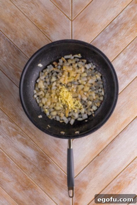 Garlic and onion in a skillet with bacon grease.