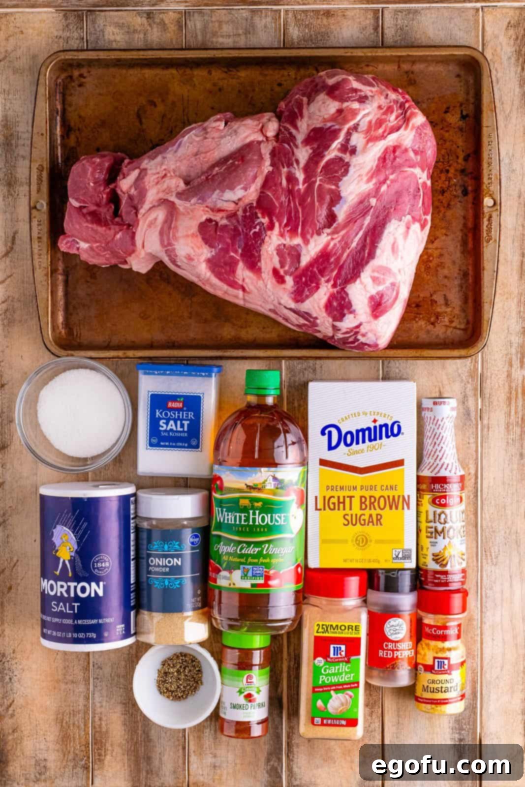 Classic Crock Pot Eastern Carolina Pulled Pork 4 Pork roast, brown sugar, kosher salt, fine salt, red chili flakes, apple cider vinegar, sugar, onion powder, garlic powder, mustard powder, smoked paprika, liquid smoke, and black pepper.