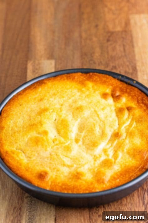 A freshly baked banana upside down cake in its pan, cooling on a wire rack after being removed from the oven.