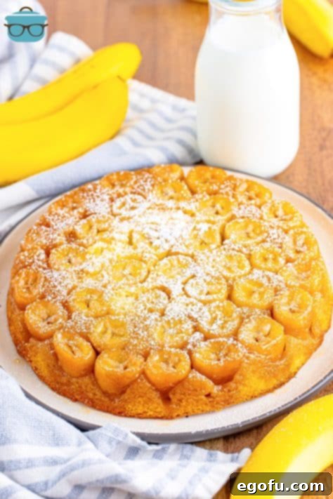 A beautifully inverted banana upside down cake on a serving plate, ready to be enjoyed.