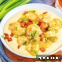 Bayou Bounty Shrimp and Grits 9 A plate of shrimp and grits.