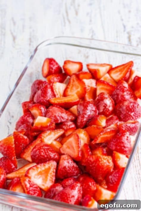 Sweet Strawberry Crumble 12 Coated strawberries in a baking dish.