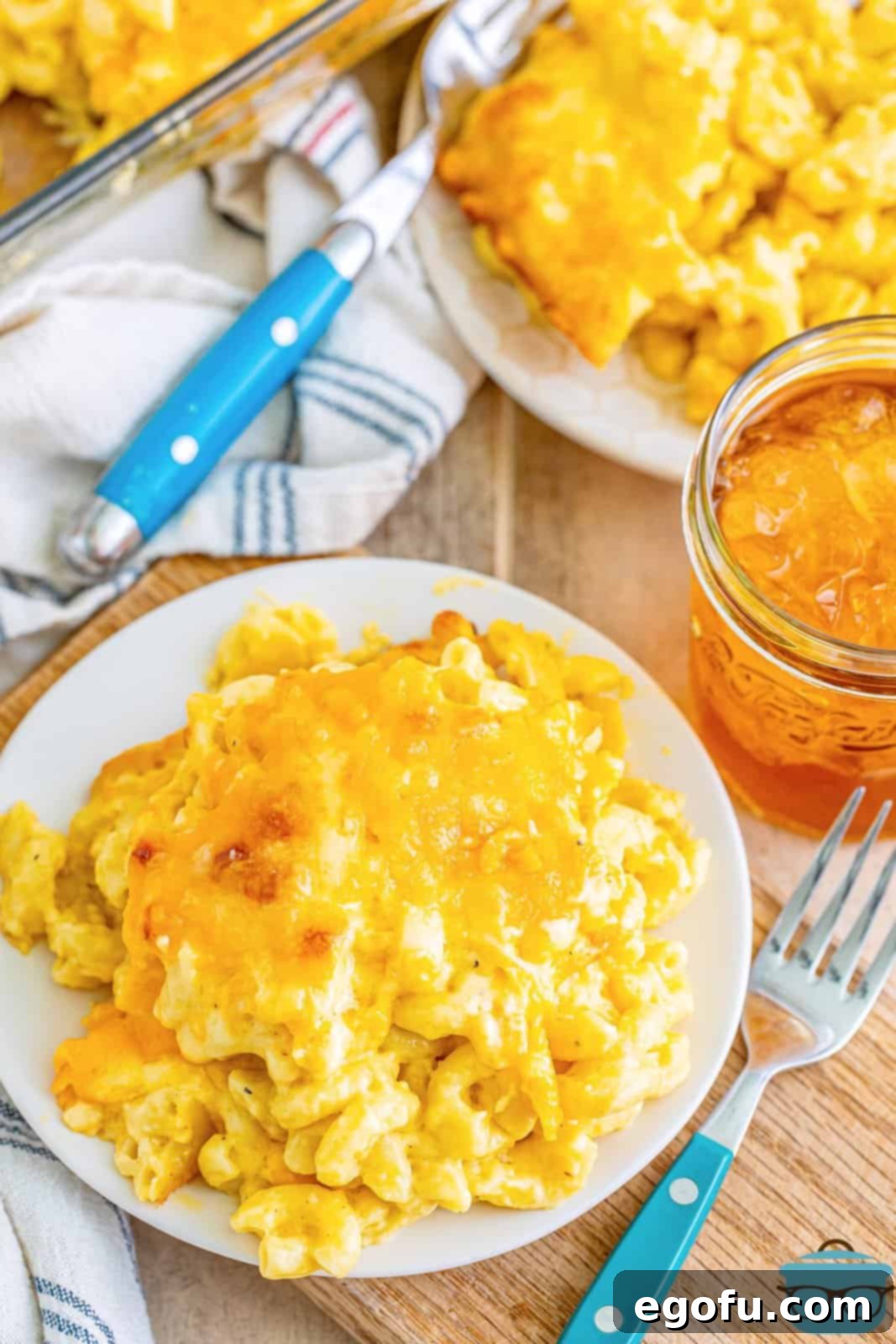Golden Crusted Macaroni 2 A generous plate of homemade Baked Mac and Cheese, showcasing its golden crust and creamy interior.
