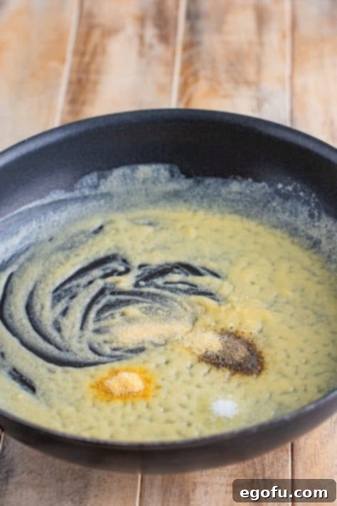 Golden Crusted Macaroni 14 A saucepan with melted butter and spices.