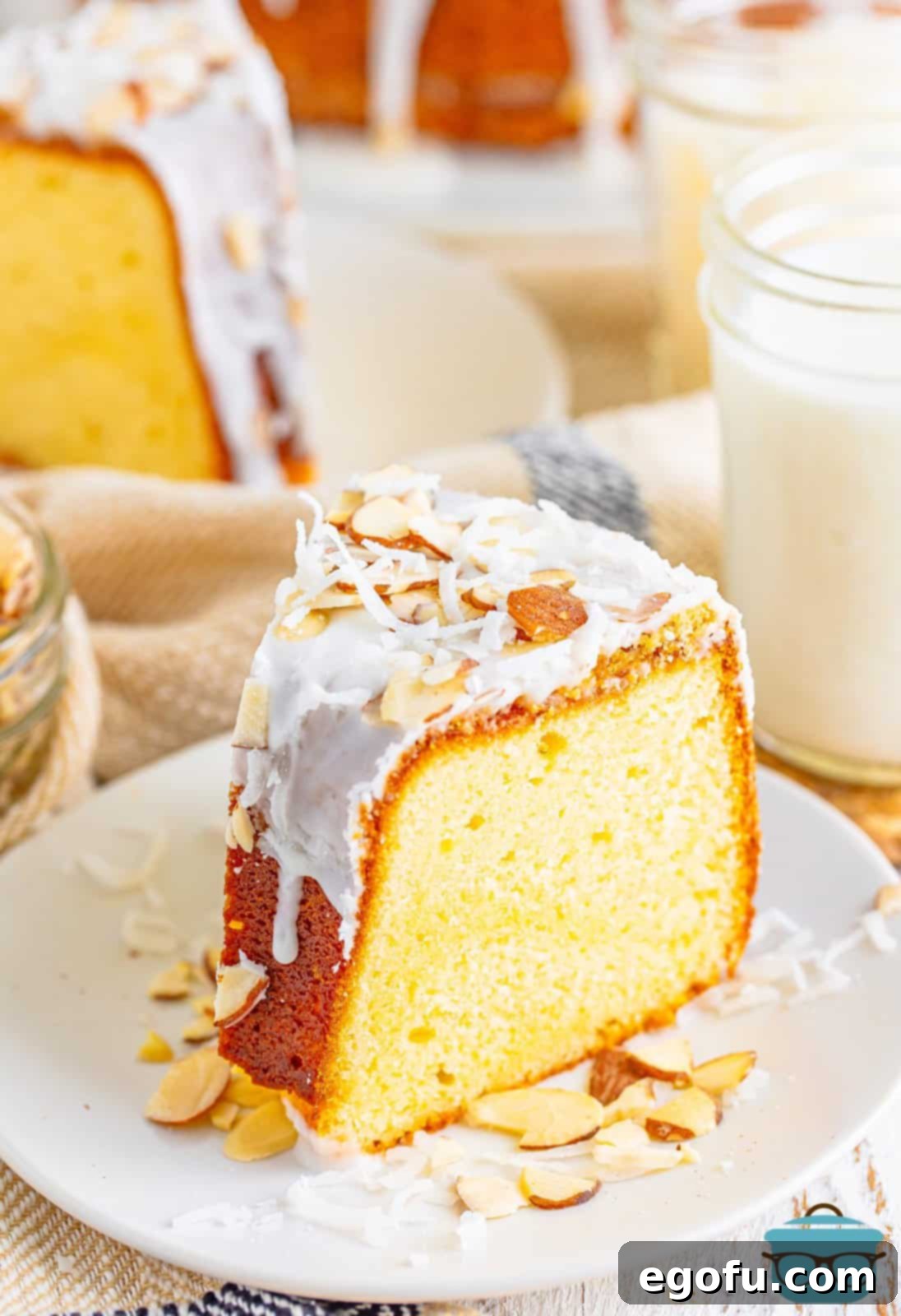 Southern Crunch Delight 12 A single slice of Louisiana Crunch Cake, beautifully plated and ready to be enjoyed, showcasing its moist texture and crunchy topping.