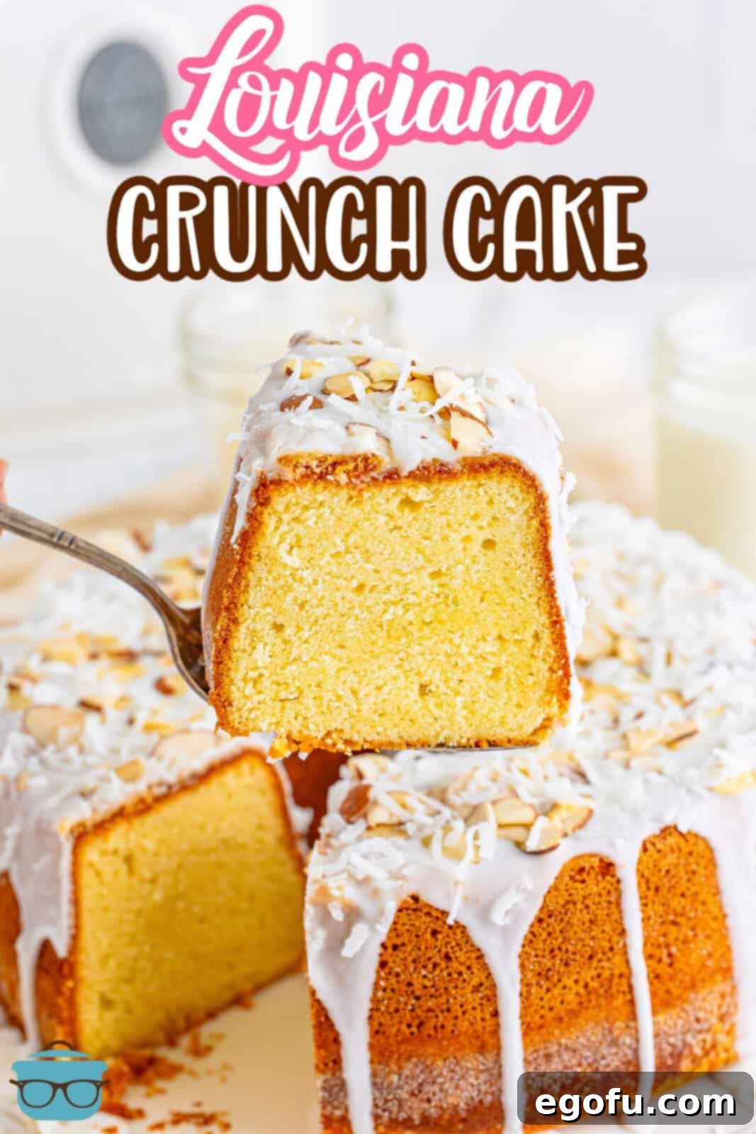 Southern Crunch Delight 3 A beautiful slice of Louisiana Crunch Cake lifted from the full, glazed cake, showing its golden-brown crust and moist interior.