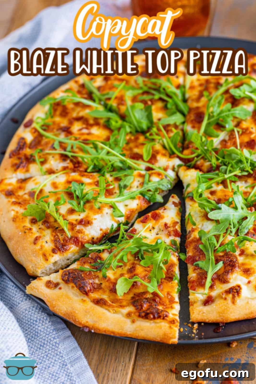 A homemade copycat Blaze White Top Pizza with a slice being removed.