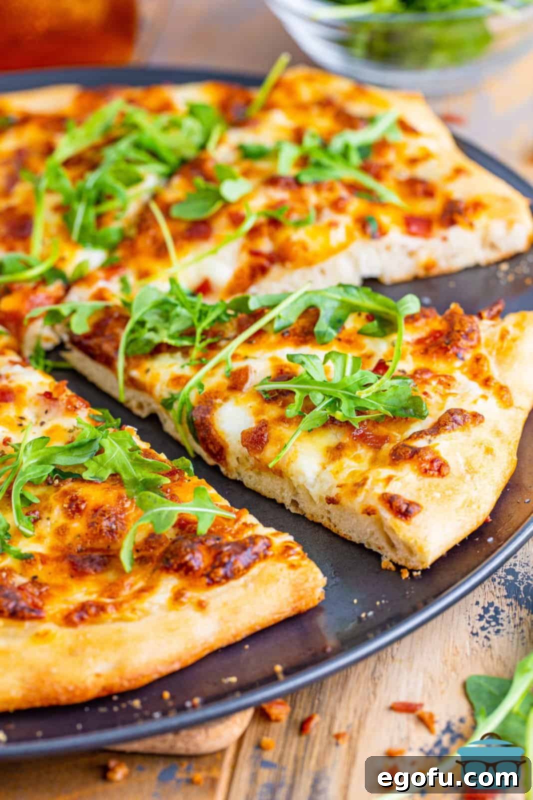 Close up looking at a slice of Blaze White Top pizza being removed from the pizza pan.