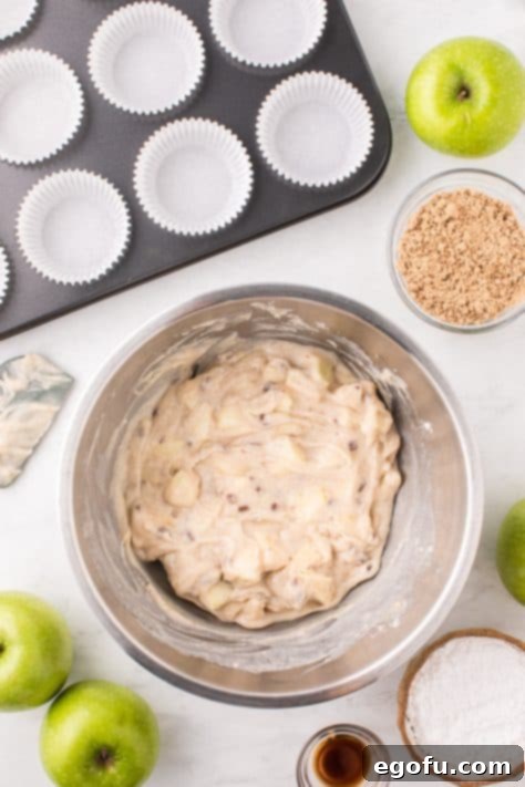 Apple streusel muffin mix in a mixing bowl, showing the combined batter.