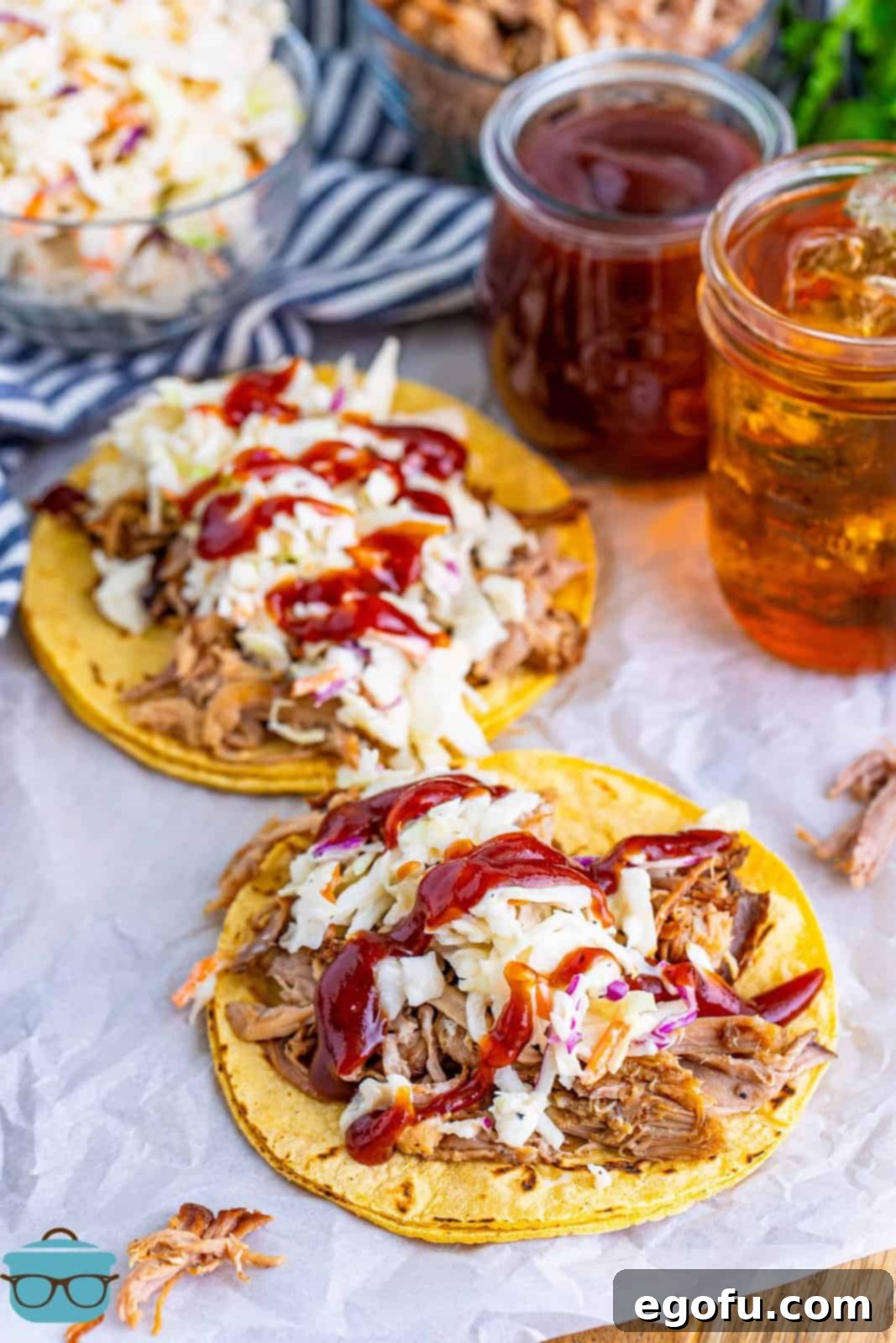 Down-Home Tacos 11 Two fully assembled Hillbilly Tacos resting on parchment paper, ready to be devoured.