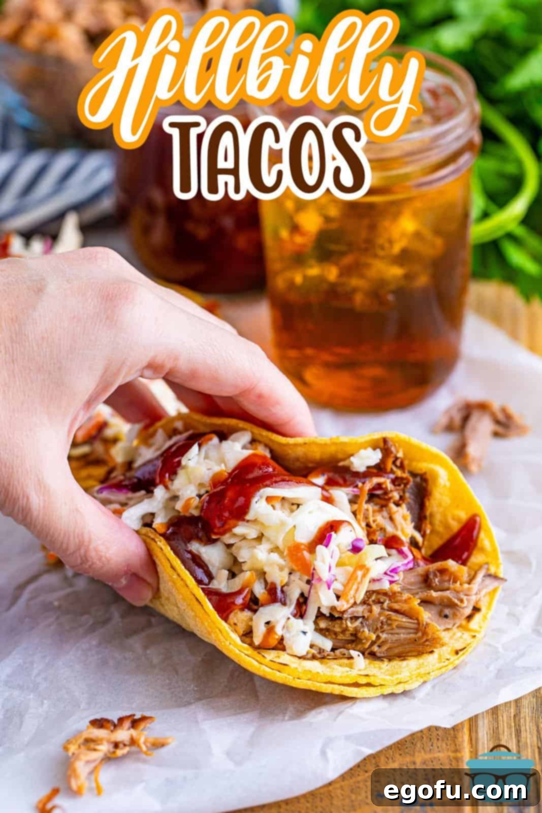 Down-Home Tacos 3 A hand picking up a freshly made Hillbilly Taco.