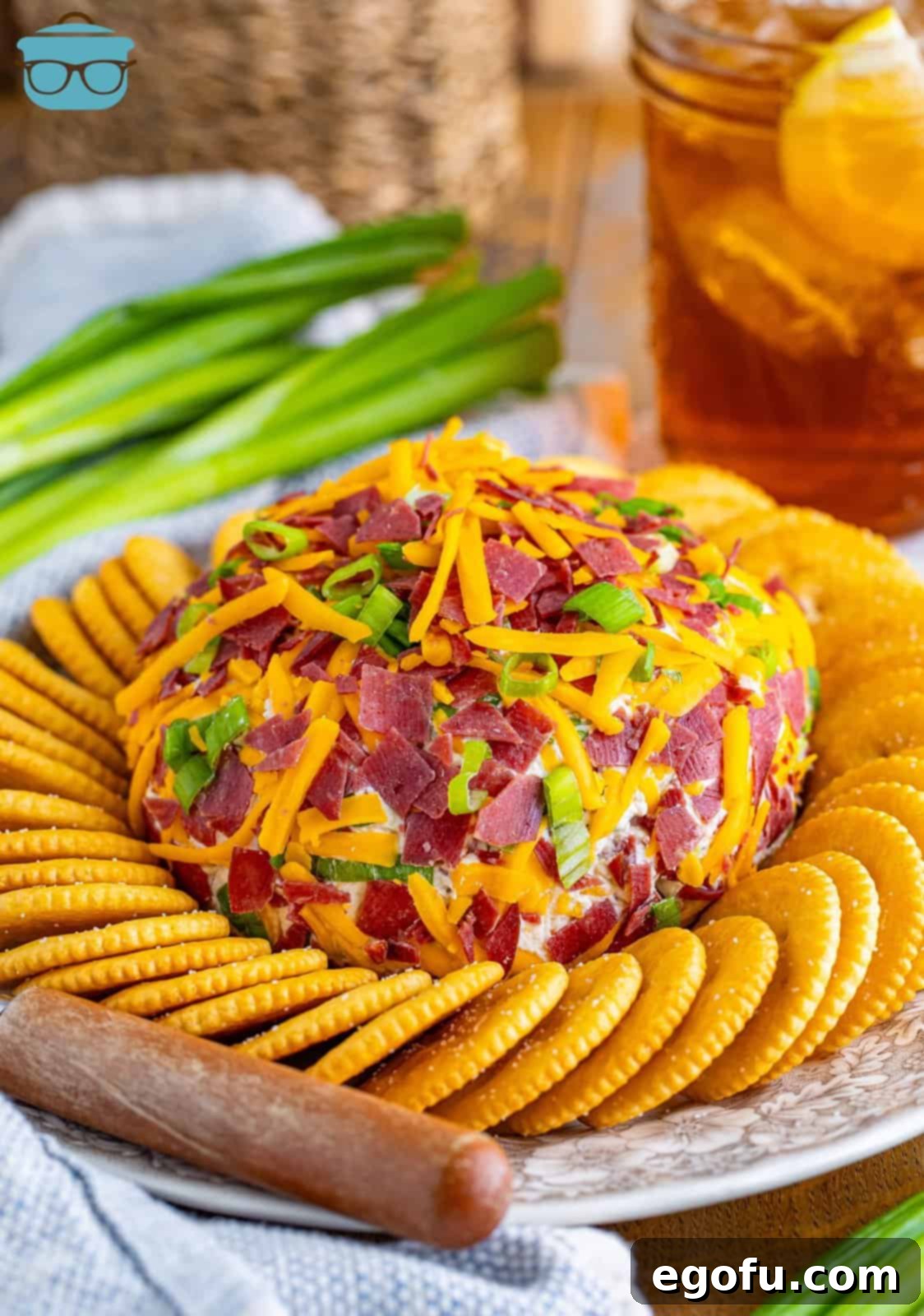 Savory Beef Cheese Delight 2 A beautifully presented dried beef cheeseball surrounded by an array of crisp crackers on an elegant serving plate, ready for guests.