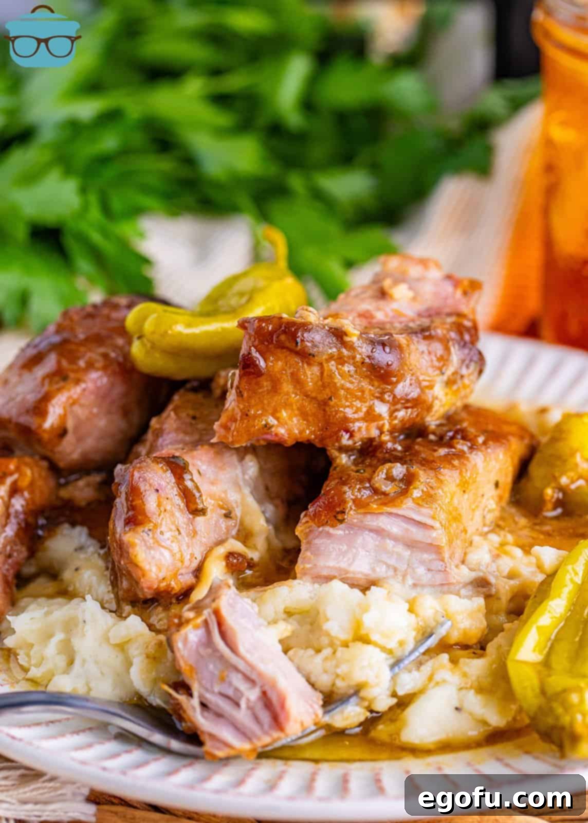 Fall-Apart Tender Mississippi Country Ribs 2 A plate of Mississippi Country Style Ribs with side dishes underneath.