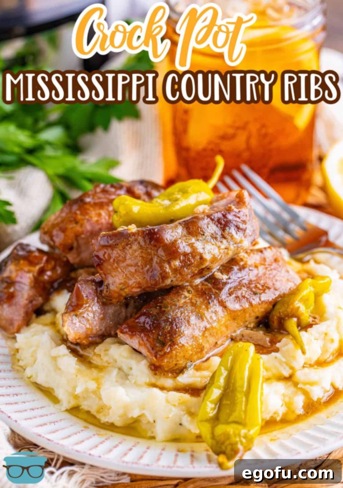 Fall-Apart Tender Mississippi Country Ribs 3 A plate of mashed potatoes with some Mississippi Country style ribs on top.