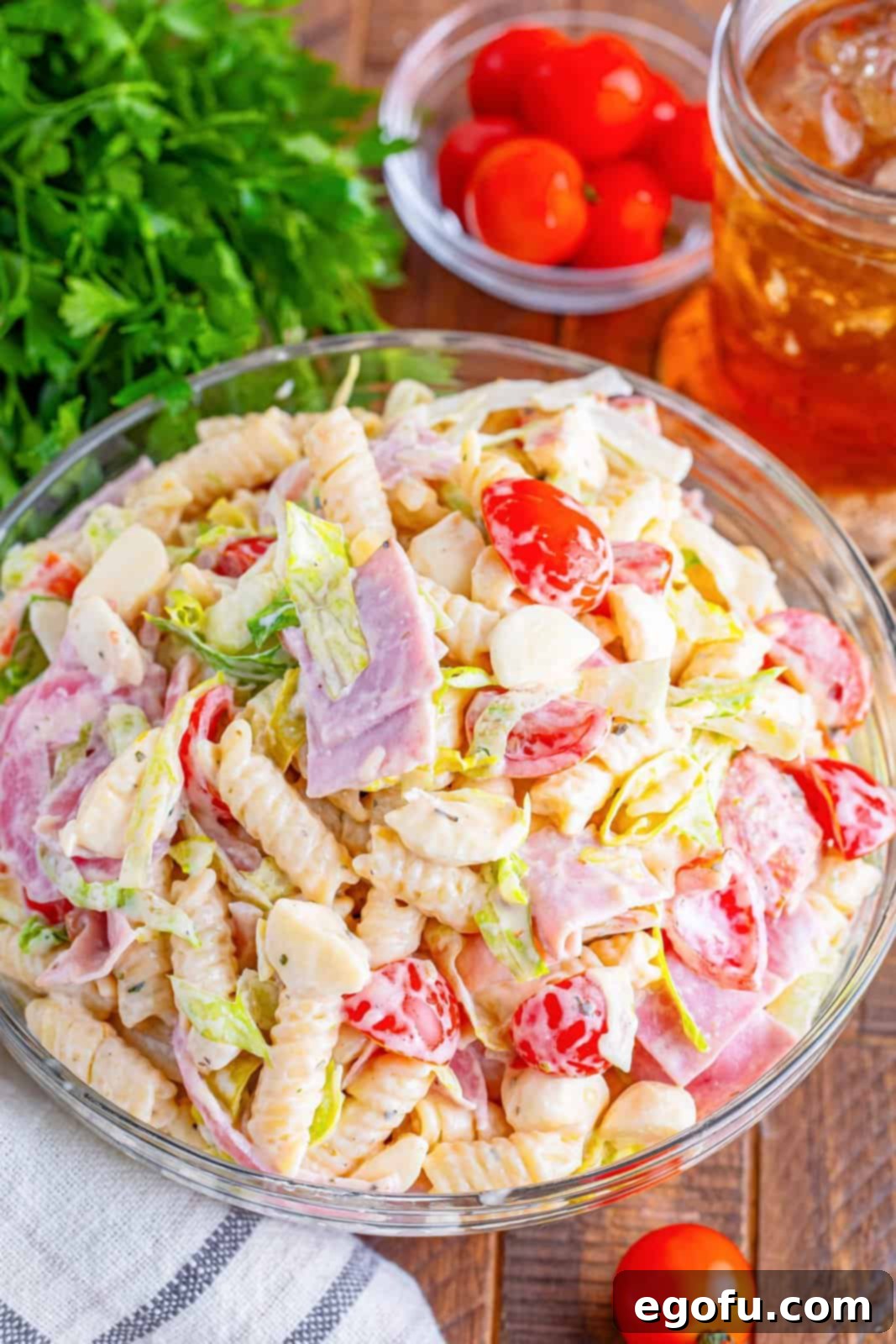 A glass bowl of Italian grinder pasta salad.