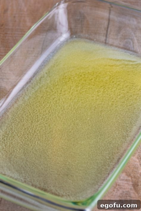 Melted butter in a baking dish.