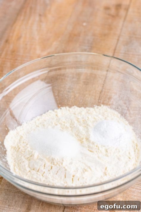 A baking dish of all-purpose flour, granulated sugar, aluminum-free and baking powder. 