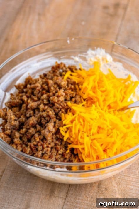 Sausage and cheddar cheese on top of the rest of the dough.