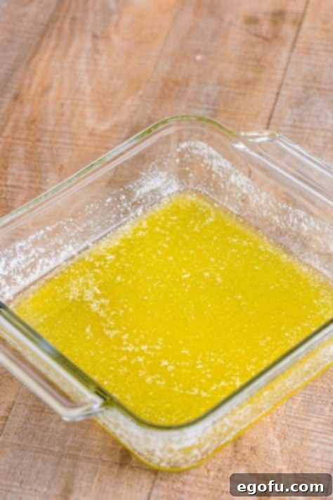 Melted butter in a baking dish.