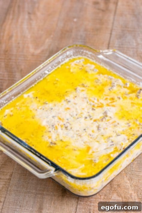Biscuit dough in melted butter in a baking dish.