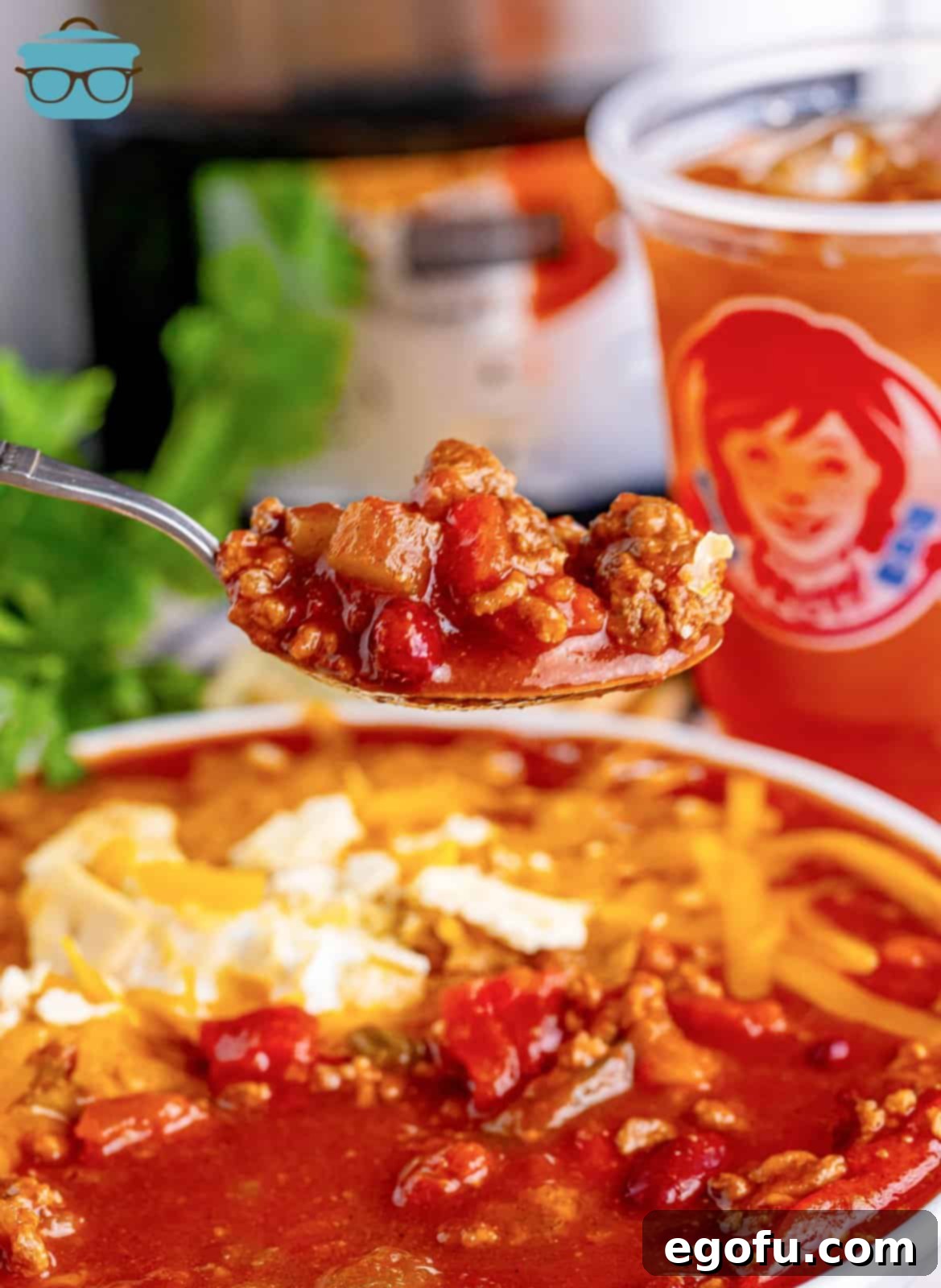 Copycat Wendy's Slow Cooker Chili 2 A spoon holding a bite of homemade Wendy's Chili.