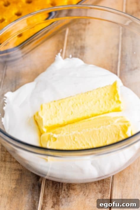 Butter and marshmallow fluff in a bowl.