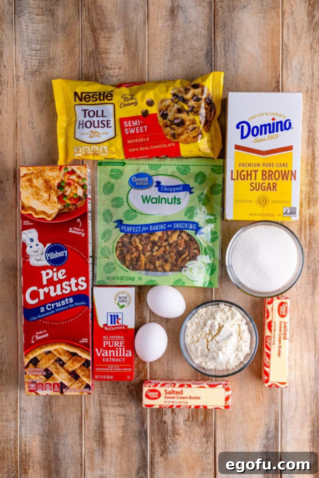 A pie crust, salted butter, semi sweet chocolate chips, walnuts, light brown sugar, granulated sugar, all purpose flour, eggs, and vanilla extract.