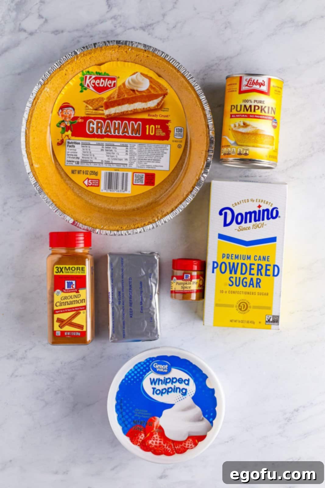 Graham cracker crust, whipped topping, powdered sugar, cream cheese, pumpkin pie spice, pumpkin puree and ground cinnamon.