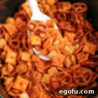 Ultimate Slow Cooker Buffalo Ranch Chex Mix 7 Close up looking at a some Buffalo Ranch Chex Mix.