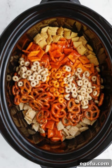 Ultimate Slow Cooker Buffalo Ranch Chex Mix 9 A slow cooker with all the ingredients for Buffalo Ranch Chex Mix.