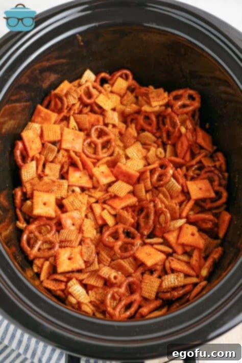 Ultimate Slow Cooker Buffalo Ranch Chex Mix 10 A crock pot insert filled with Buffalo Ranch Chex Mix.