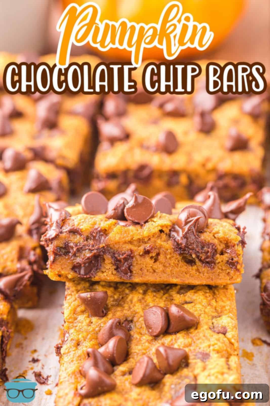 A few freshly cut Pumpkin Chocolate Chip Bars arranged on a cooling rack, highlighting their moist texture and uniform shape.