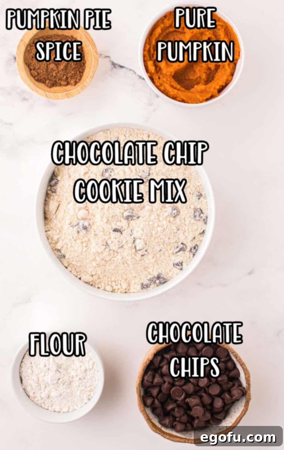 A flat lay image displaying the five key ingredients for Pumpkin Chocolate Chip Bars: a bag of chocolate chip cookie mix, a bowl of semi-sweet chocolate chips, a measuring cup of all-purpose flour, a small container of pumpkin pie spice, and a can of pumpkin puree.