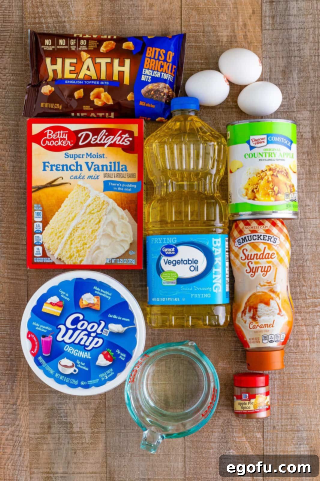 Vanilla cake mix, Cool Whip, eggs, oil, apple pie filling, heath bits, water, apple pie spice, and caramel sauce.