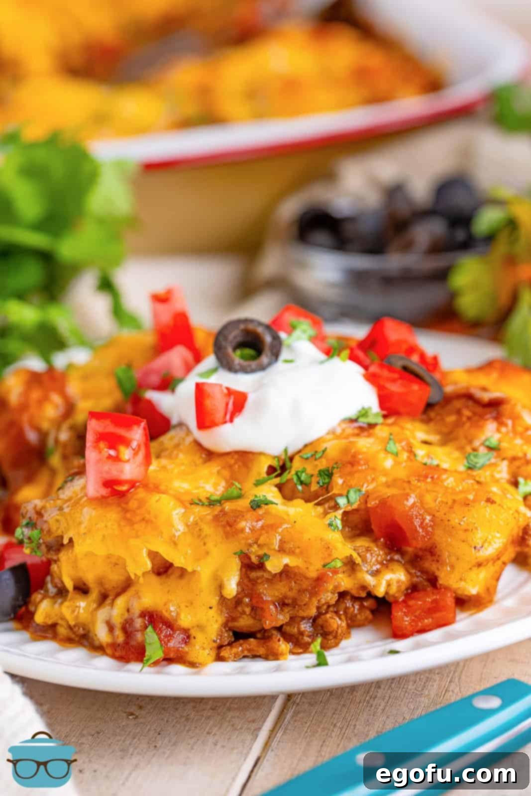 A plate of Taco Bubble Up casserole, showing golden biscuits, seasoned beef, and melted cheese, ready to be enjoyed.