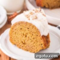 A white plate with a piece of Pumpkin Bundt Cake.
