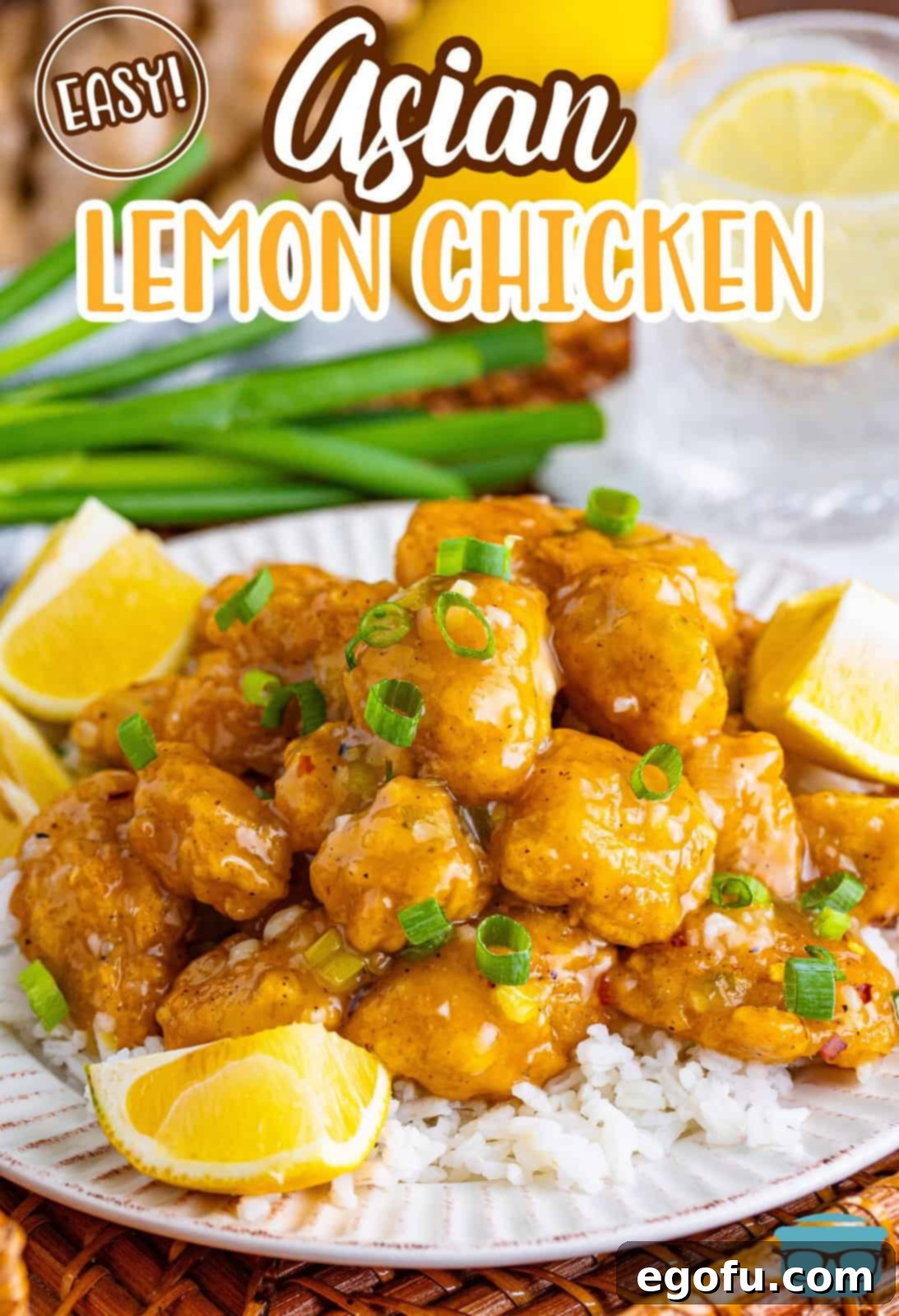 A plate with a bed of white rice and Asian Lemon Chicken on top.