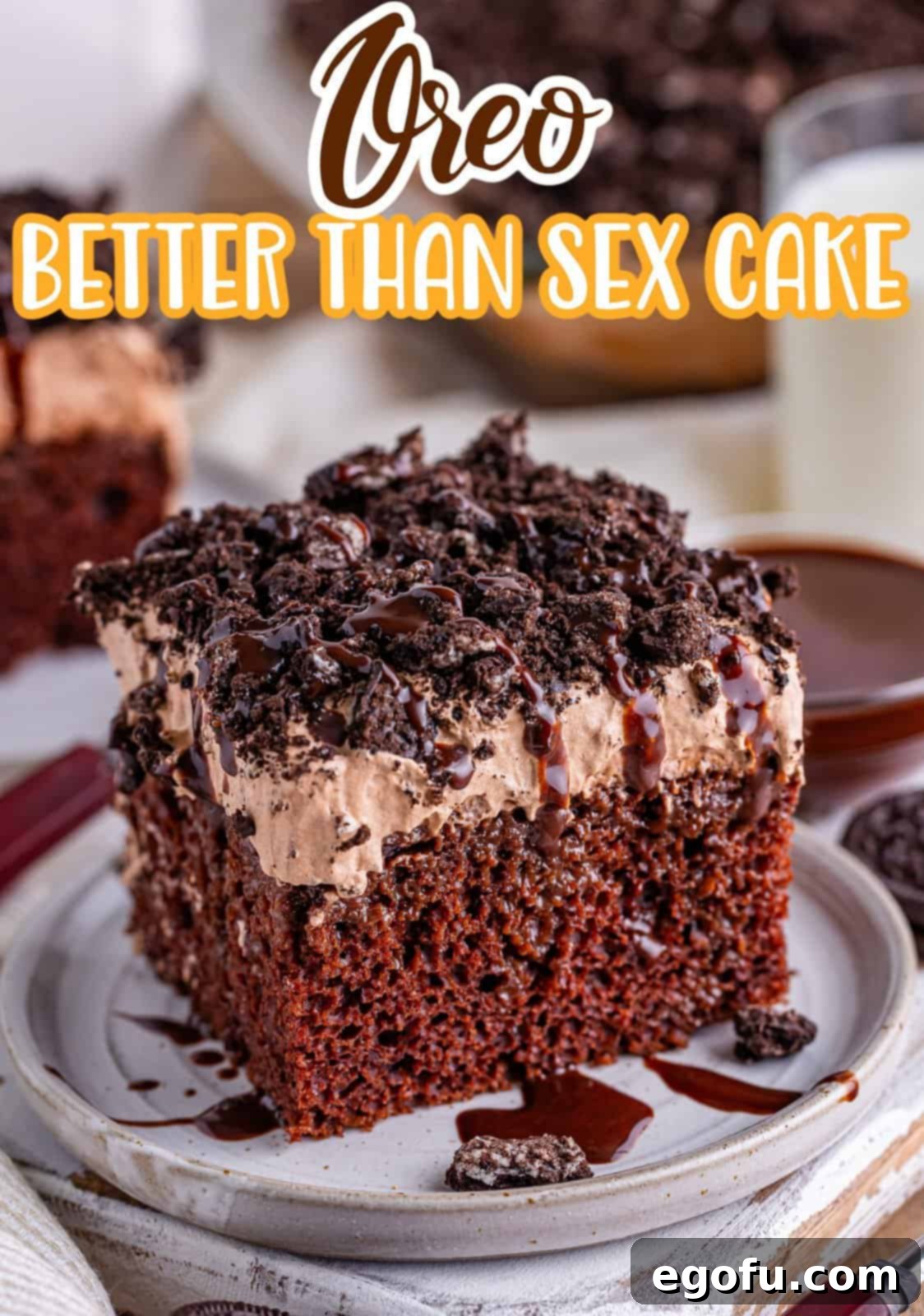 Heavenly Oreo Dream Cake 3 A luscious slice of Oreo Better Than Sex Cake on a serving plate, showing off its rich chocolate layers and creamy topping.