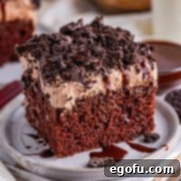 Heavenly Oreo Dream Cake 10 A dessert plate with a slice of Oreo cake, ready to be enjoyed.