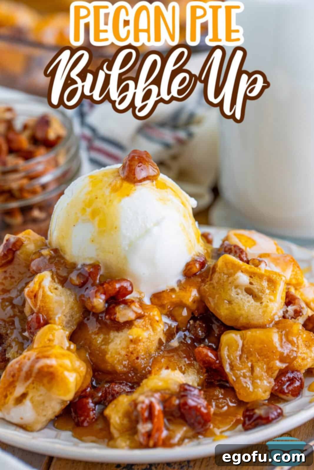 Gooey Pecan Pull-Apart Bake 3 A white dessert plate with a generous serving of Pecan Pie Bubble Up, garnished with powdered sugar.